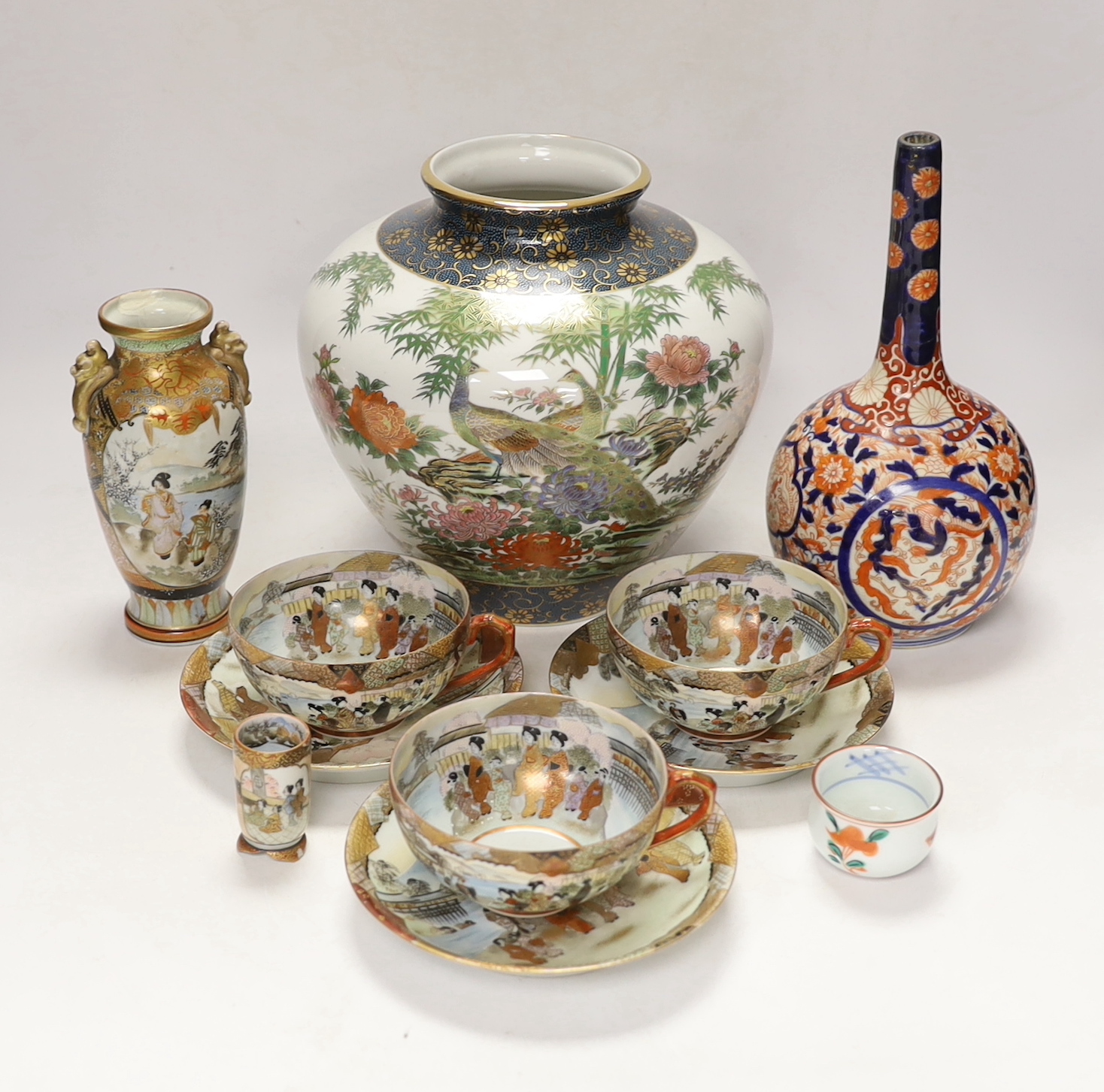 Japanese ceramics including an Imari bottle vase, a Satsuma vase and Kutani eggshell porcelain, tallest 22cm (8)